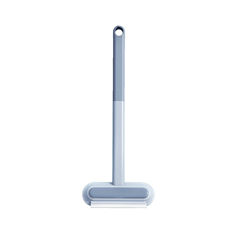 Cleaning brush with roller on a white background