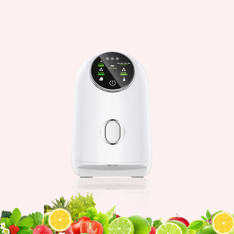 A white DIY Fruit Mask Maker with a screen and control buttons on a white background with greenery at the bottom.