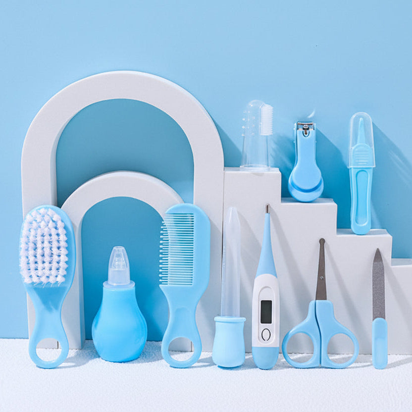 Set of baby care products including brushes, bottles, and scissors on a blue background with text.